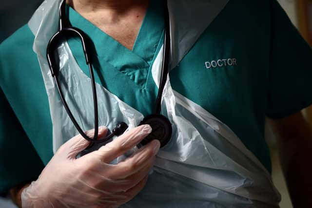 EMBARGOED TO 0001 TUESDAY JUNE 13 File photo dated 17/05/20 of a junior doctor holding his stethoscope at The Royal Blackburn Teaching Hospital in East Lancashire. The NHS will face "enormous" disruption as junior doctors in England go out on strike later this week, a top doctor has warned. Almost all routine or pre-planned care could be impacted in some way, according to Professor Sir Stephen Powis, NHS England's national medical director. Issue date: Tuesday June 13, 2023.