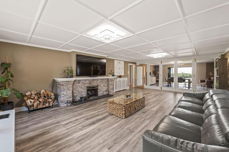 The lounge with the dining room in the distance.