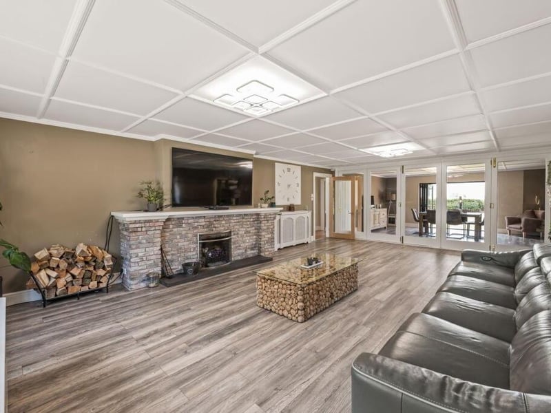 The lounge with the dining room in the distance.