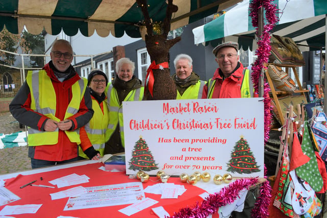 All smiles from the Children’s Christmas Tree Committee members and helpers as they sold their raffle tickets