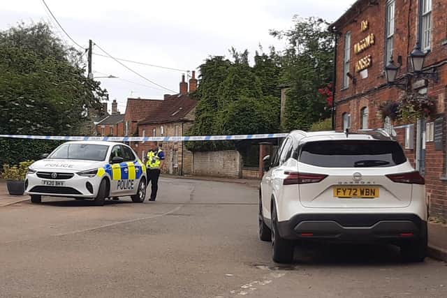 The police cordon on Caythorpe High Street due to the suspected mortar round found.