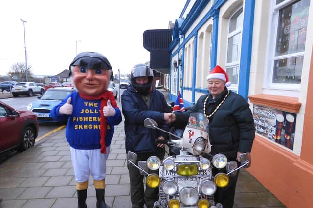 Mark Dannatt (centre) outside the Seaview Pub in Skegness ahead of the ride with the Mayor of Skegness Coun Pete Barry and the Jolly Fisherman. Photo: Ann Robinson