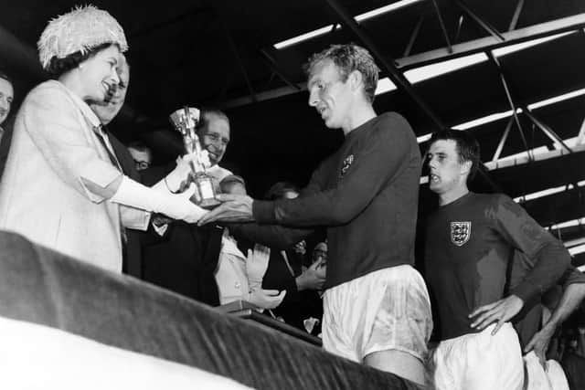 Queen Elizabeth II presents the World Cup to England captain at Wembley in 1966. Photo:  AFP via Getty Images.