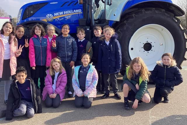 Redwood Primary School pupils welcome a visit from Leadenham farmer Andrew Ward and his tractor. Photo: LAS
