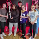 Top Limitz Dance Academy wirth their trophy for coming third in the 101 UK Championships. Caris Black (third right) proudly holds her trophy for becoming overall champion.