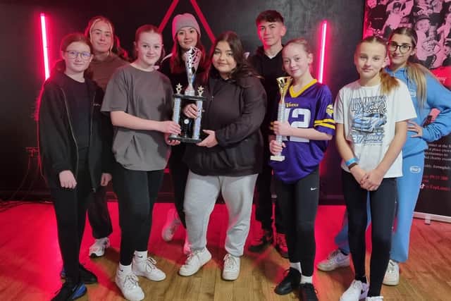 Top Limitz Dance Academy wirth their trophy for coming third in the 101 UK Championships. Caris Black (third right) proudly holds her trophy for becoming overall champion.