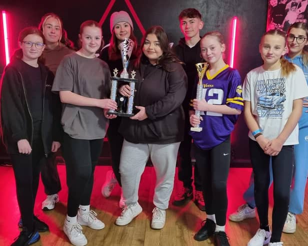 Top Limitz Dance Academy wirth their trophy for coming third in the 101 UK Championships. Caris Black (third right) proudly holds her trophy for becoming overall champion.