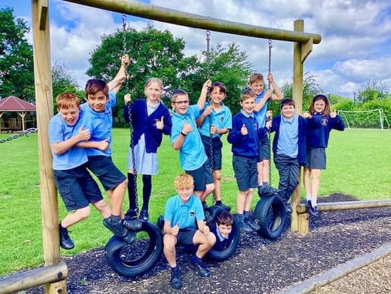 Donington on Bain Primary School pupils celebrate their Good Ofsted grade.