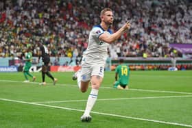 Jordan Henderson of England celebrates after scoring the team's first goal against Senegal at the Al Bayt Stadium. (Photo by Dan Mullan/Getty Images)