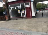Multiple posters were placed in shop windows
