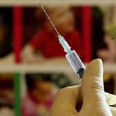 File photo dated 10/08/24 of a nurse handling a syringe at a medical centre in Ashford, Kent. Millions of parents in England are being urged to book their children in for missed measles, mumps, and rubella (MMR) jabs, amid a "very real risk" of measles outbreaks across the country. Officials said the decline in the uptake of routine childhood vaccinations is a "serious concern". Issue date: Monday January 22, 2024.