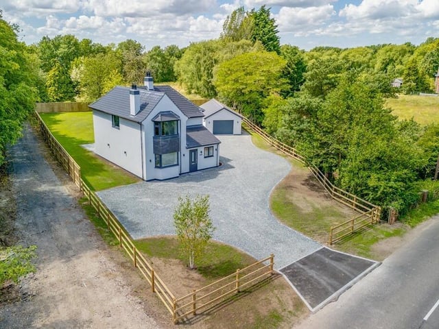 An aerial view of the home from the road.