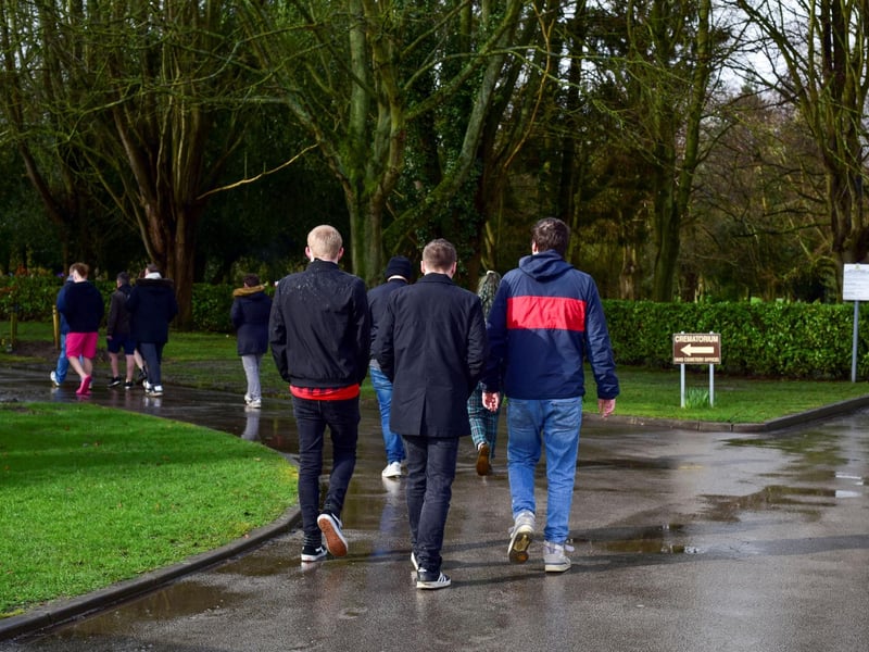 Friends and family make their way into Boston Crematorium for Adi's funeral