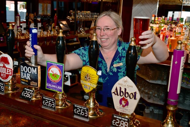 Manager, Abbey Gibb, at the bar of the refurbished Red Lion pub.