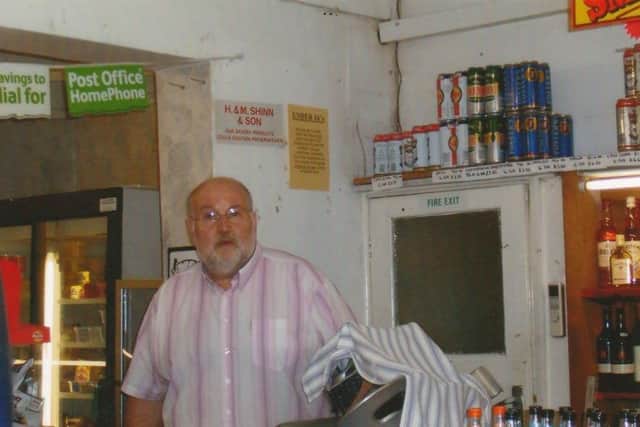 Tom Hedges inside his post office in Hogsthorpe in 2005.