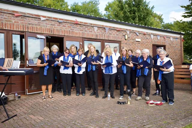 Minting Community Choir performing at the motorshow.