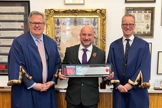 PCC Marc Jones receiving his certificate as a Freeman of London. (Supplied)
