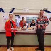 Volunteers helping out at Age UK's Christmas event.