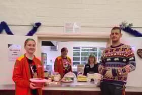 Volunteers helping out at Age UK's Christmas event.