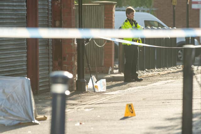 Police at the scene of the crime in Fountain Lane, Boston, today.
