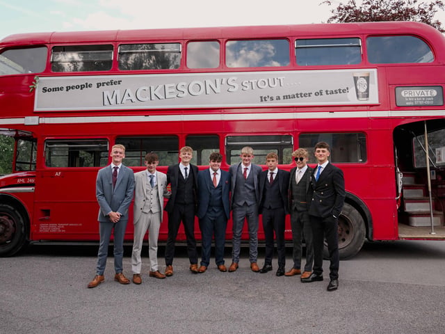 A double decker bus was the mode of transport for these students.