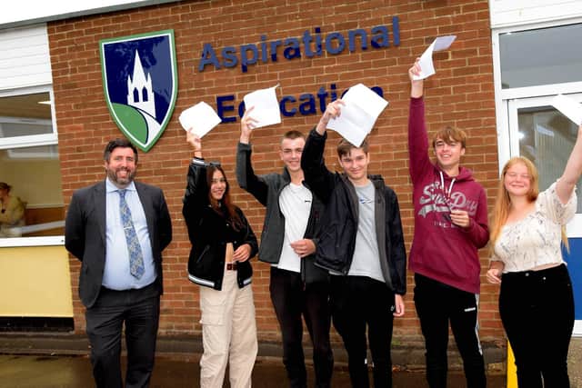Louth Academy GCSE students and Principal Philip Dickinson.