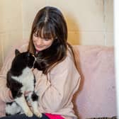 Beanie the cat with Emma Murphy at Ark Animal Rescue.
