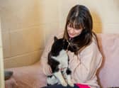 Beanie the cat with Emma Murphy at Ark Animal Rescue.