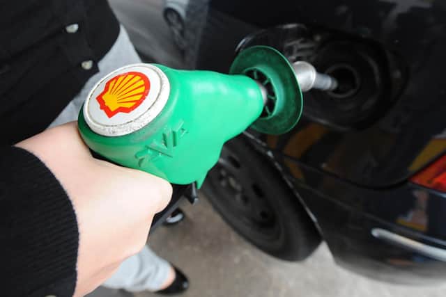 A person fills up at a Shell petrol station in Newcastle, as last-minute talks to avert a fuel strike began today, as 500 petrol tanker drivers prepare for a four-day walkout.