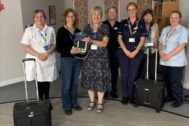 Louth United Charities Trustees and hospice staff with the new equipment funded.
