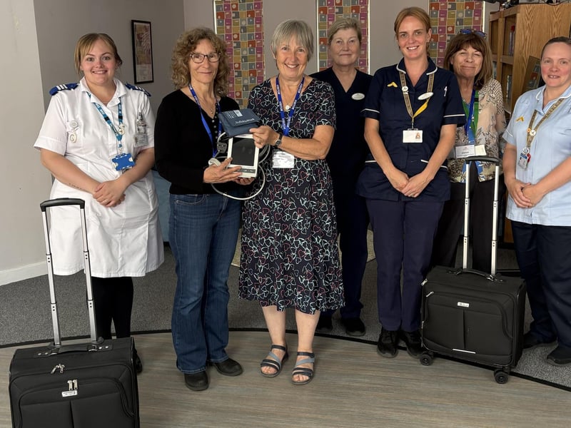 Louth United Charities Trustees and hospice staff with the new equipment funded.
