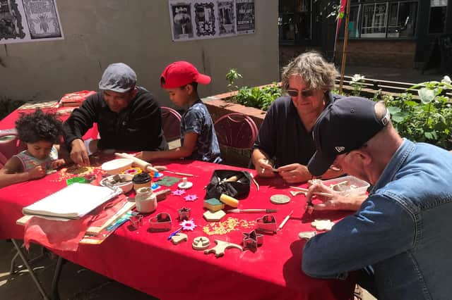 Members of the community taking part in a previous art session for the Dolphin Lane project.