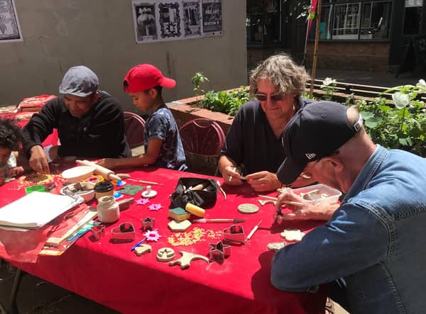Members of the community taking part in a previous art session for the Dolphin Lane project.