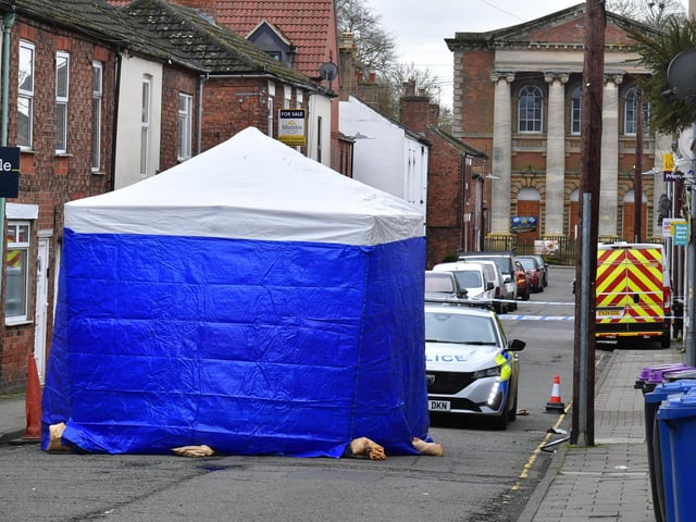 Investigators and a police cordon remain at the scene of a suspected fatal stabbing on Union Street, Market Rasen. Photo: David Dawson