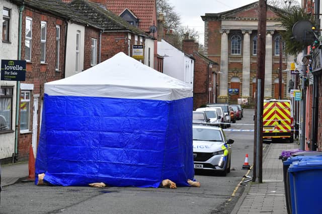 Investigators and a police cordon remain at the scene of a suspected fatal stabbing on Union Street, Market Rasen. Photo: David Dawson