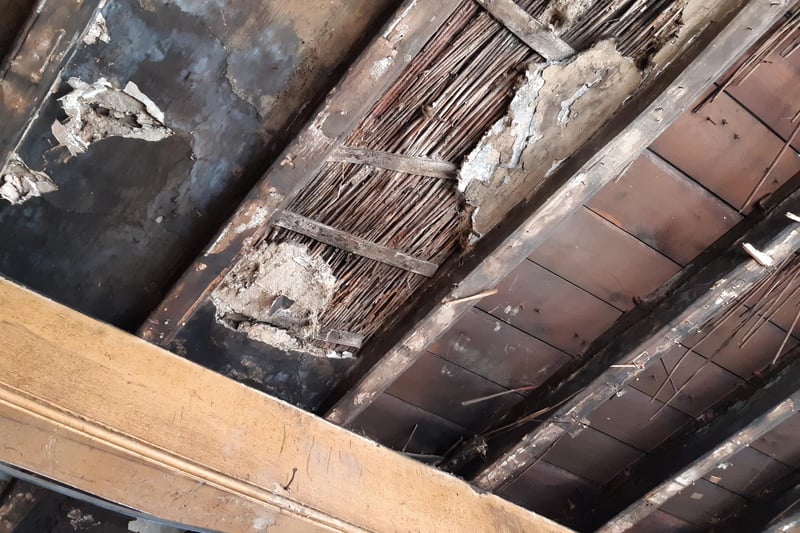 A closer look at the fire-damaged ceiling, previously out of sight.