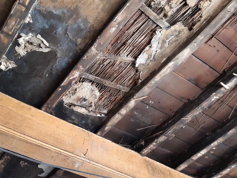 A closer look at the fire-damaged ceiling, previously out of sight.