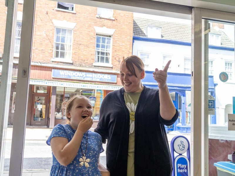 Olivia and mum, Kelly, seeing the artwork for the first time at Horncastle Food Store