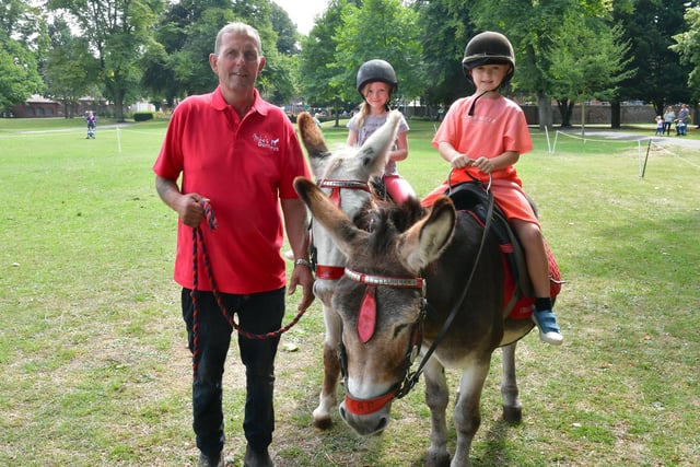 Mike Thomes of Mike's Donkeys, Everlyn Saxby, aged four, of Heckington, Freddie Hirst, aged seven, of Boston.
