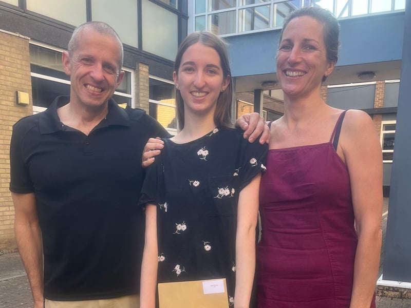 Bella Thomas pictured with her parents as she celebrated achieving A*AA grades. Photo: KSHS