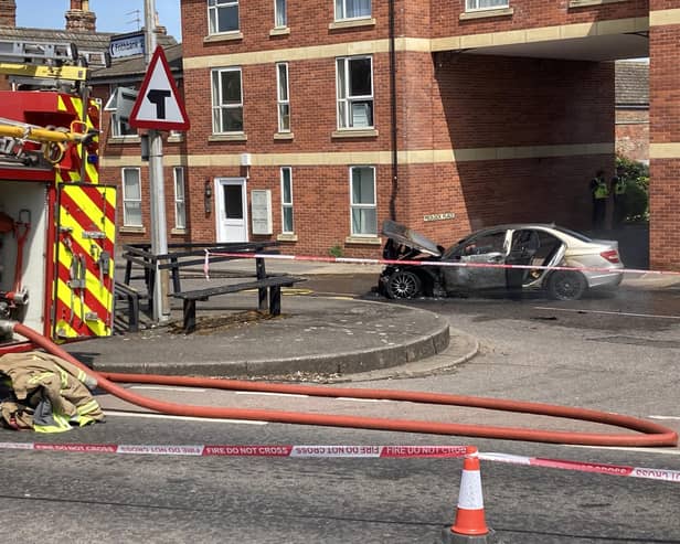 The burnt-out car in Tattershall Road, Boston.