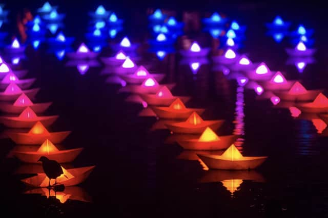 Voyage features a flotilla of oversized origami style colour changing boats on the huge pond at Belton House