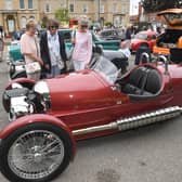 Sisters Val Gray, Sue Brain and Pauline Collett of Helpringham admiring a Morgan three-wheeler sports car at last year's show.