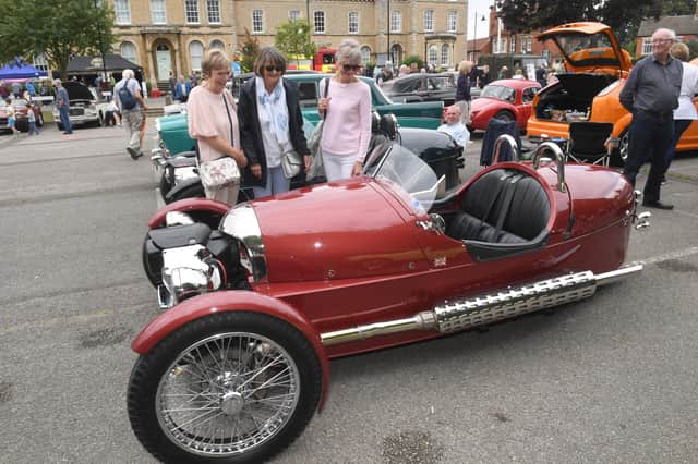 Sisters Val Gray, Sue Brain and Pauline Collett of Helpringham admiring a Morgan three-wheeler sports car at last year's show.