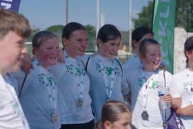 Medal winners - children with their medals at the finish line of the triathlon