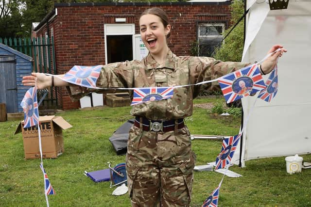 Cpl Meredith Rutland prepares the bunting. Photo: Stephen Hullott