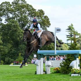 Tom Strawson riding Public Address during the cross country phase of the Defender Burghley Trophy.