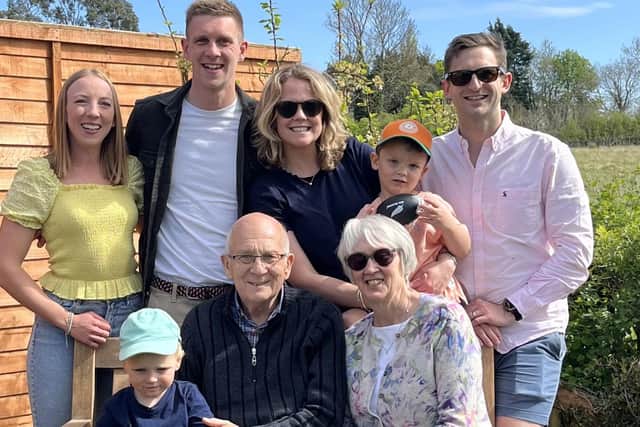 John and Alison Harris surrounded by members of their proud family, including daughter Samantha, running son James and two of their grandchildren