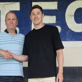 Russ Wilcox welcomes new signing Adam Crookes. Photo by Dave Horsley