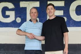 Russ Wilcox welcomes new signing Adam Crookes. Photo by Dave Horsley